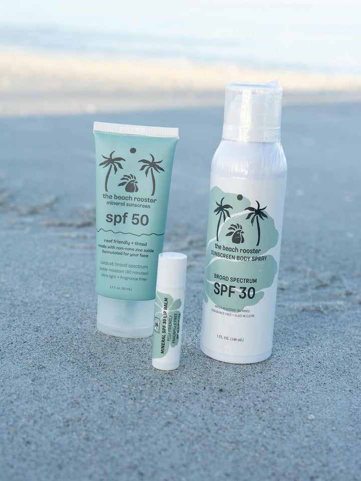 The Beach Rooster Bundle SPF Mineral Sunscreen, Face, Body and Lips with a beach background 