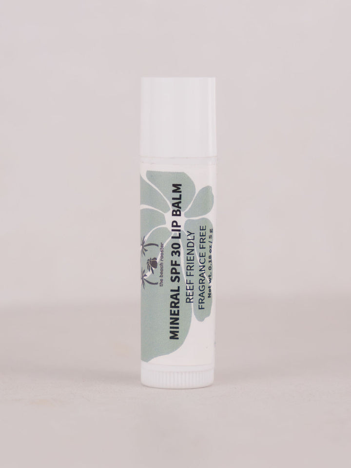 SPF 30 Mineral Lip balm with a white and green label on a light gray background